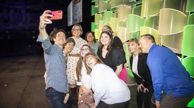 A group of people pose for a selfie.