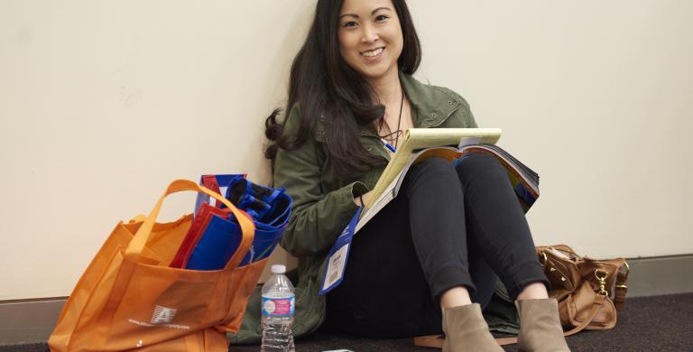 CEC2016_STL_young-ethnic-woman-seated-on-floor-with-notes